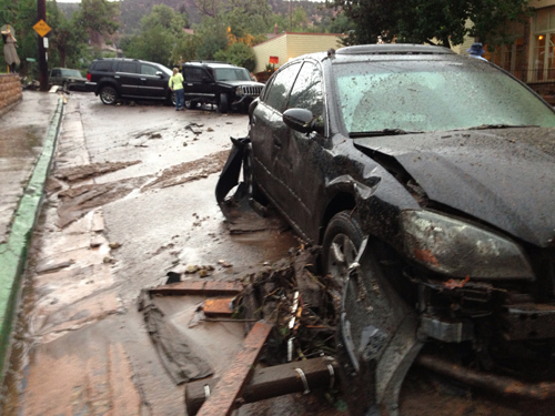 Vehicles washed down Canon Ave. This is in front of the post office, across the street from Cliff House.