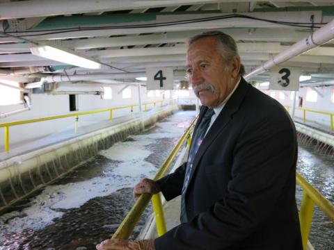 Steve Smith, director of Colorado Correctional Industries, tours an on-prison greenhouse that houses a tilapia farm.