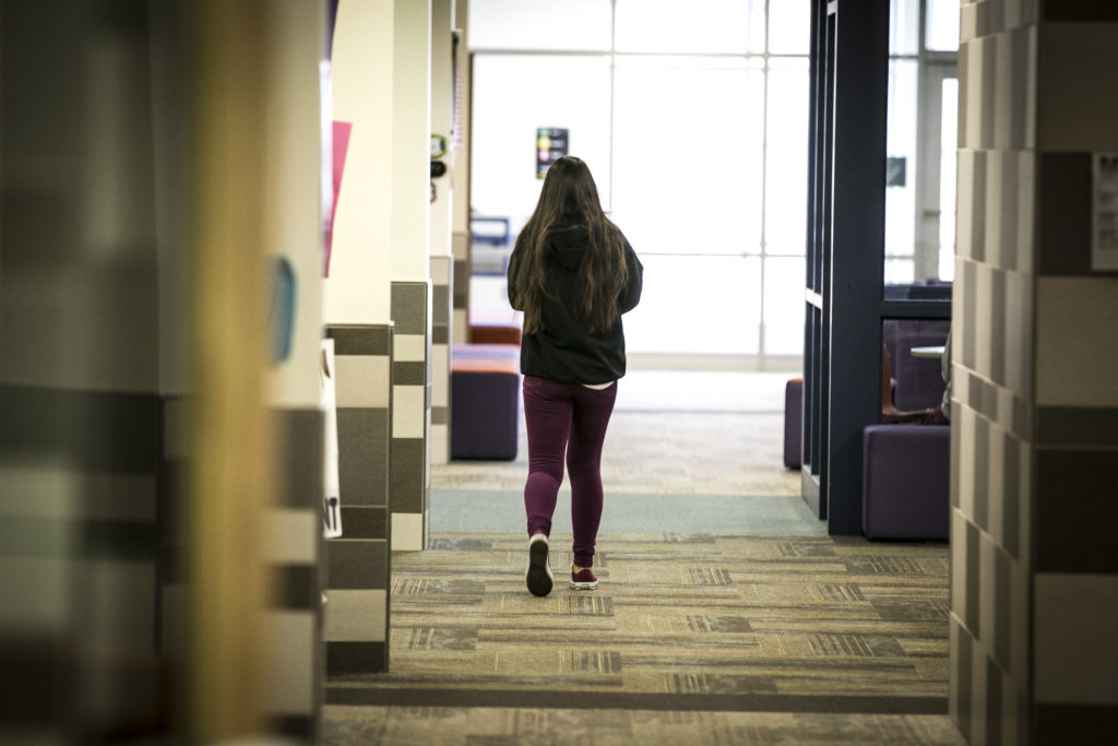 Photo Fort Logan Northgate student 1 Walking Down Hall Colorado