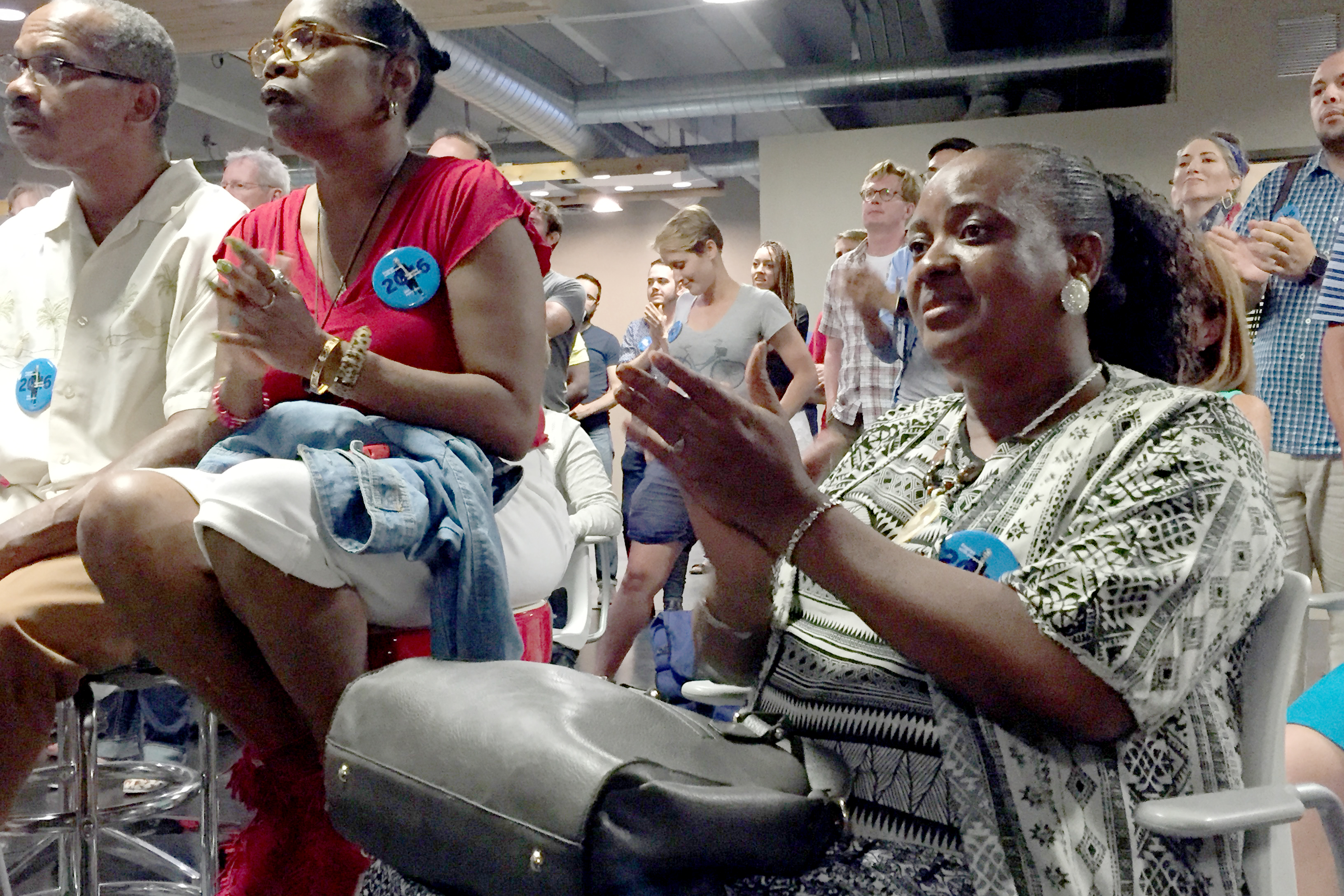 Photo: Eunice Walker of Denver and members of her family applaud Hillary Clinton's acceptance speech