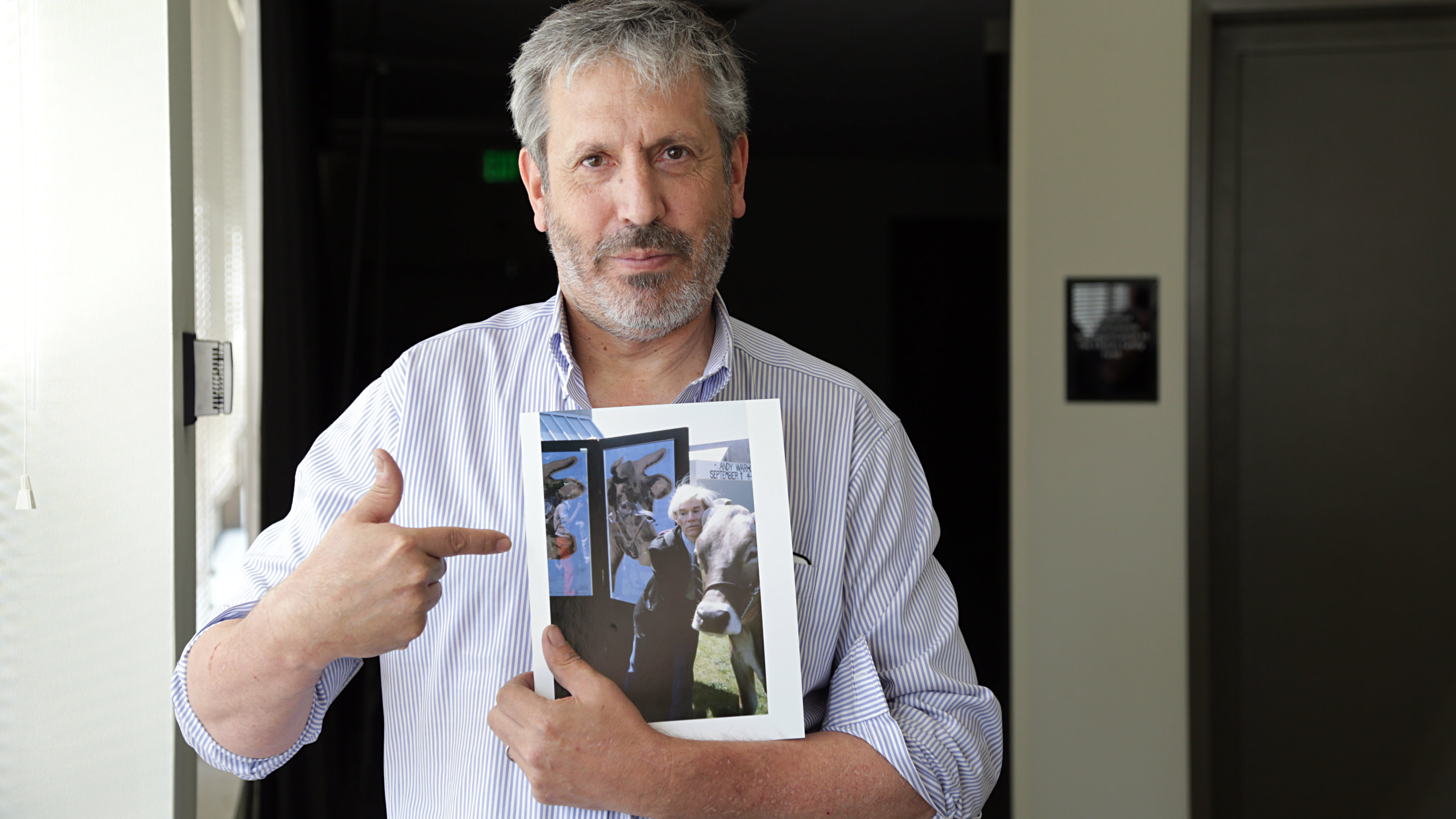 Photo: Mark Sink with photo of Andy Warhol