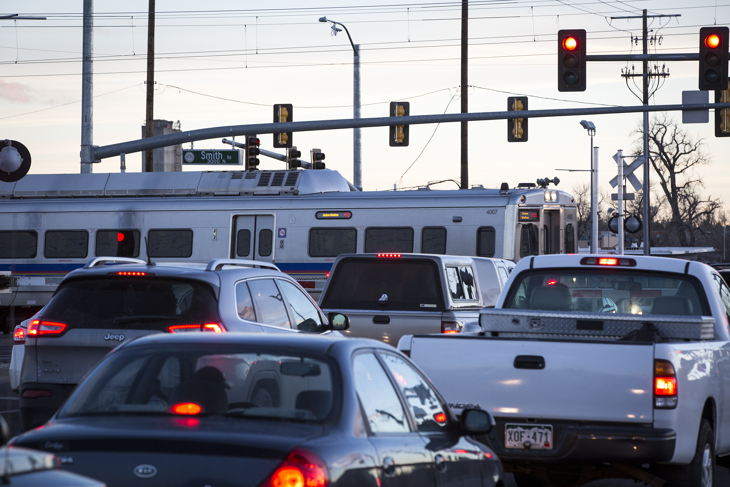 <p>As rush hour traffic waits, an A Line train crosses Chambers Road at Smith Road in Aurora On Monday, Jan. 7, 2018.</p>