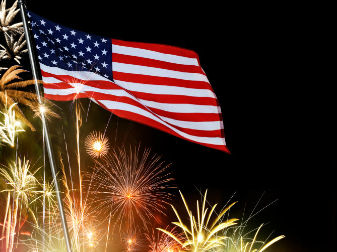 Photo: American flag with fireworks