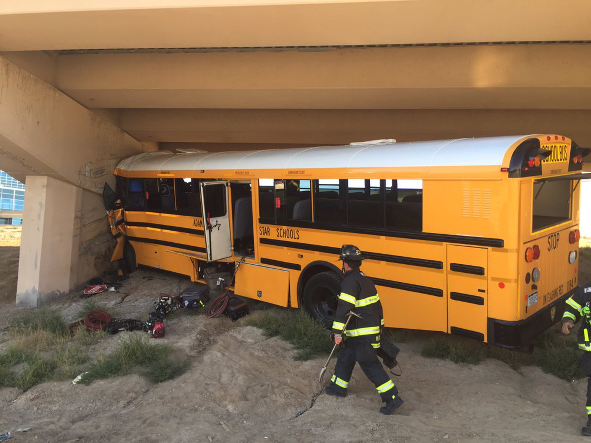 Photo: DIA bus crash (AP Photo)