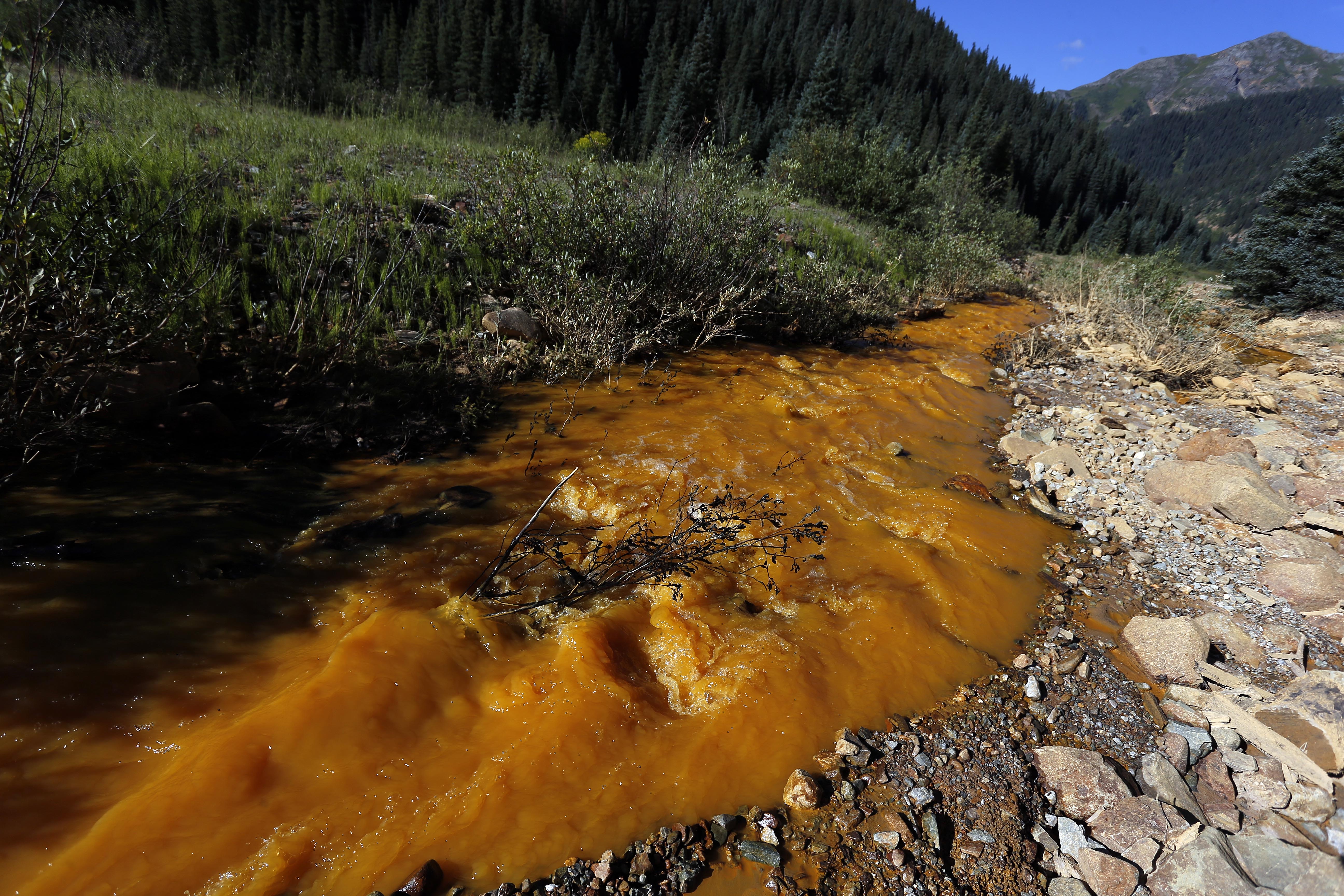 Photo: Cement Creek water flows toward Animas River, away from Gold King Mine (AP Photo)