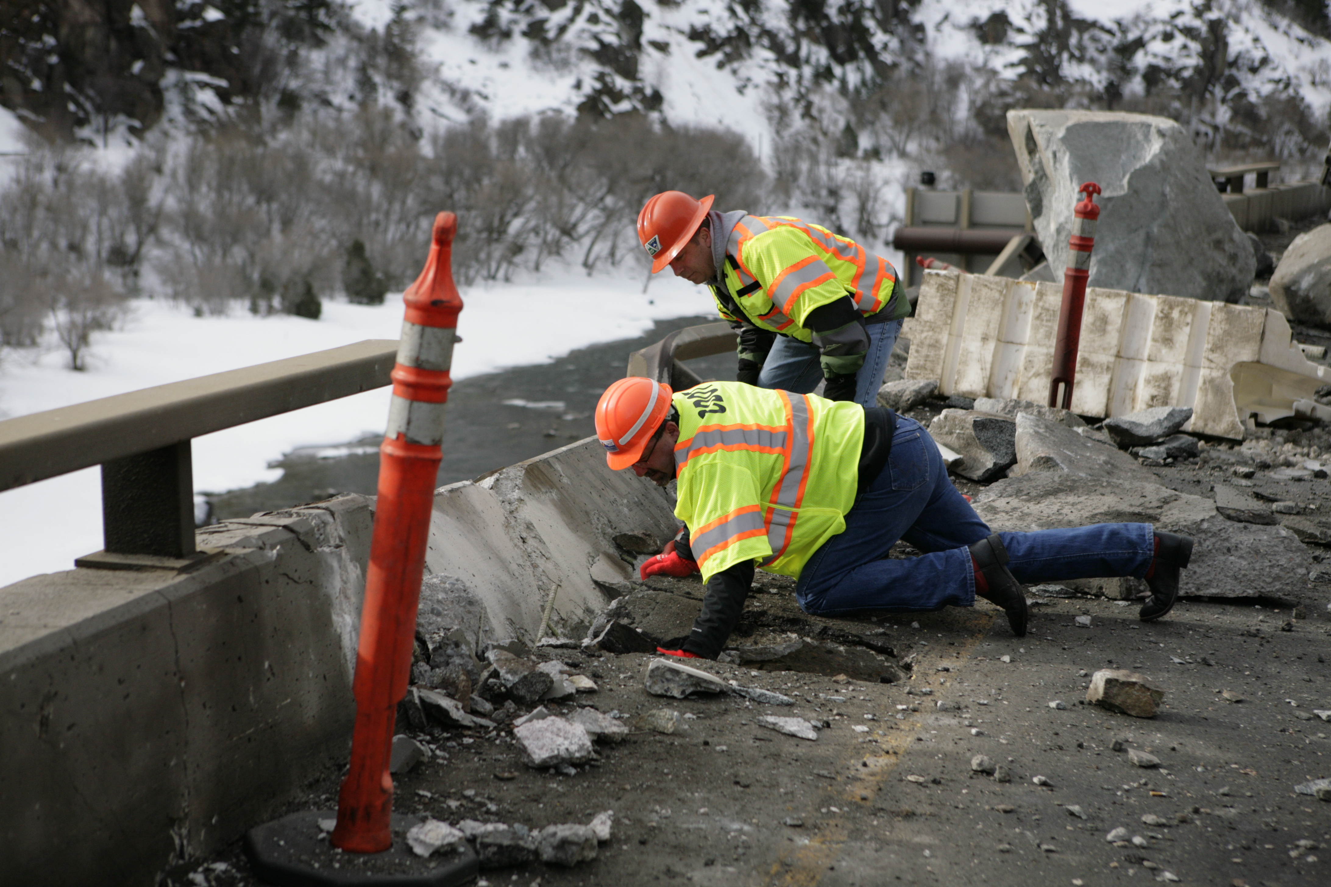 Photo: Workers inspect I-70 in Glenwood Canyon (AP Photo)