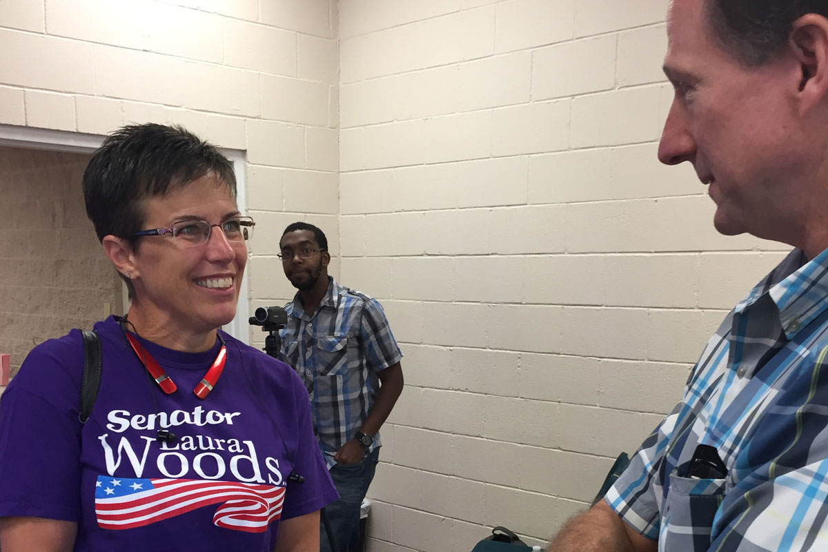 Photo: State Sen. Laura Woods Meets With Voter During Town Hall