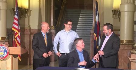 &lt;p&gt;Colo. Governor John Hickenlooper signs a bill at the State Capitol in Denver asking voters to allow the state to keep revenue generated from marijuana sales. &lt;/p&gt;
