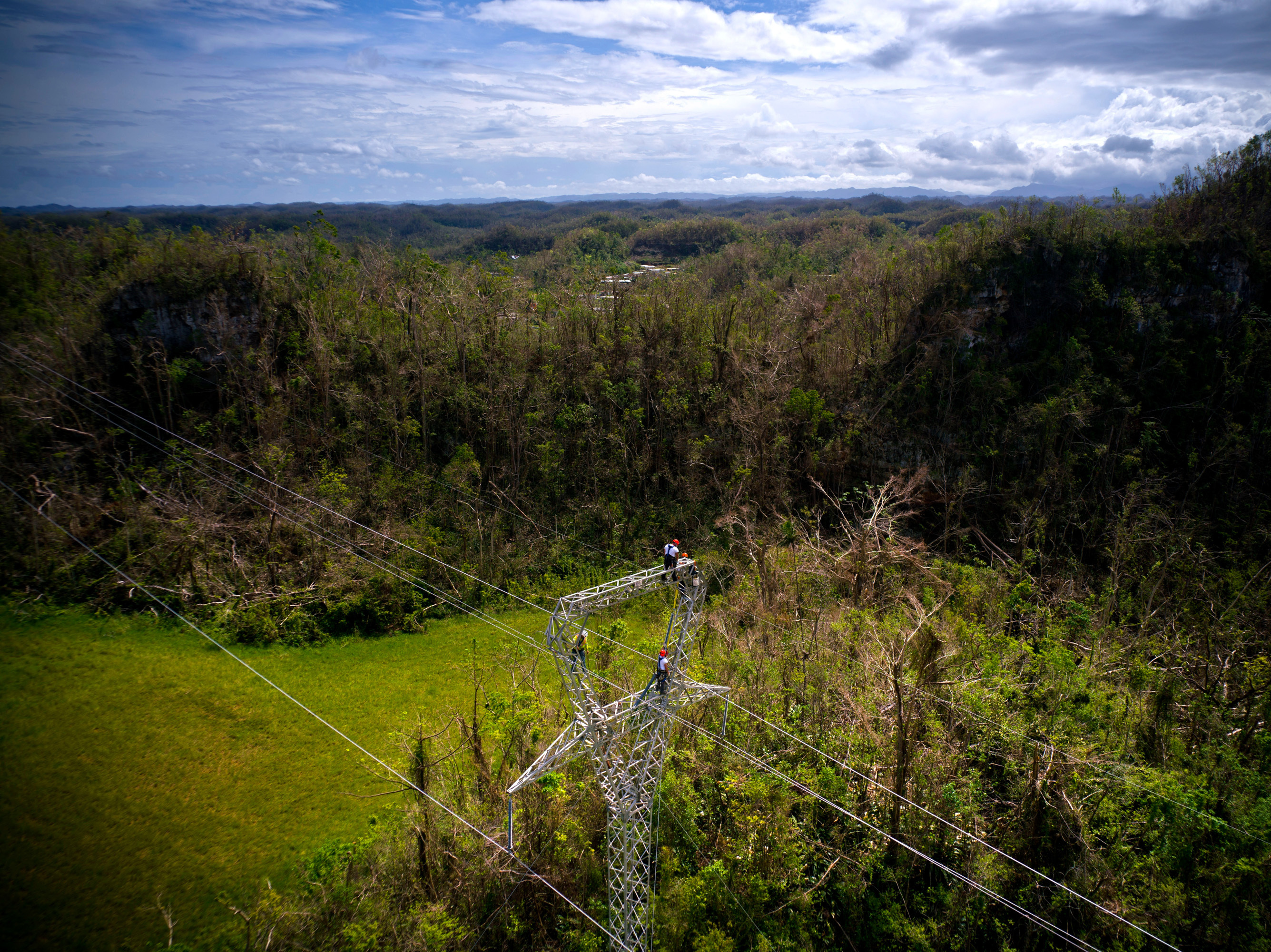 Whitefish Energy workers restore damaged lines in Barceloneta, Puerto Rico, on Oct. 15. A $300 million contract between the tiny company and Puerto Rico's electric authority has come under intense scrutiny.