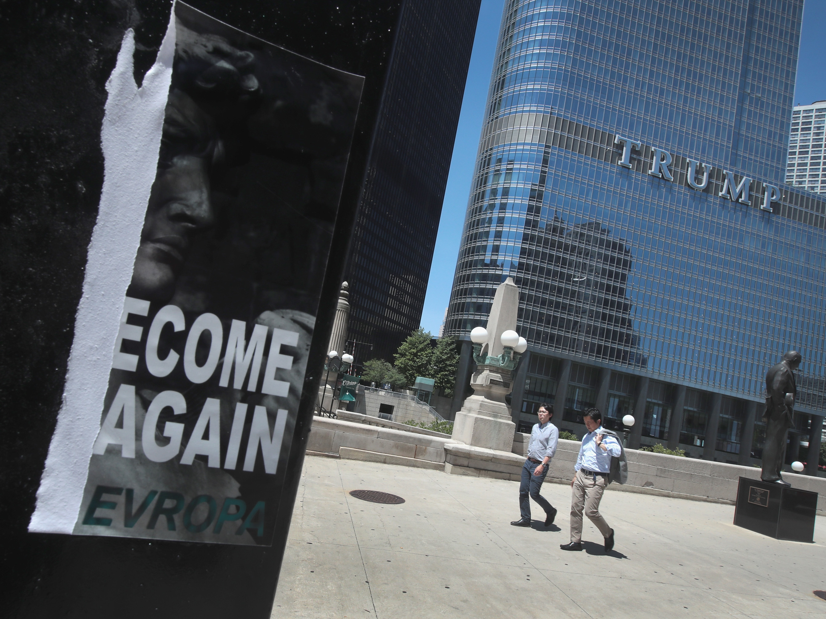 A defaced recruiting flyer for Identity Evropa hangs near Trump Tower in Chicago, in July 2016. The flyer which read