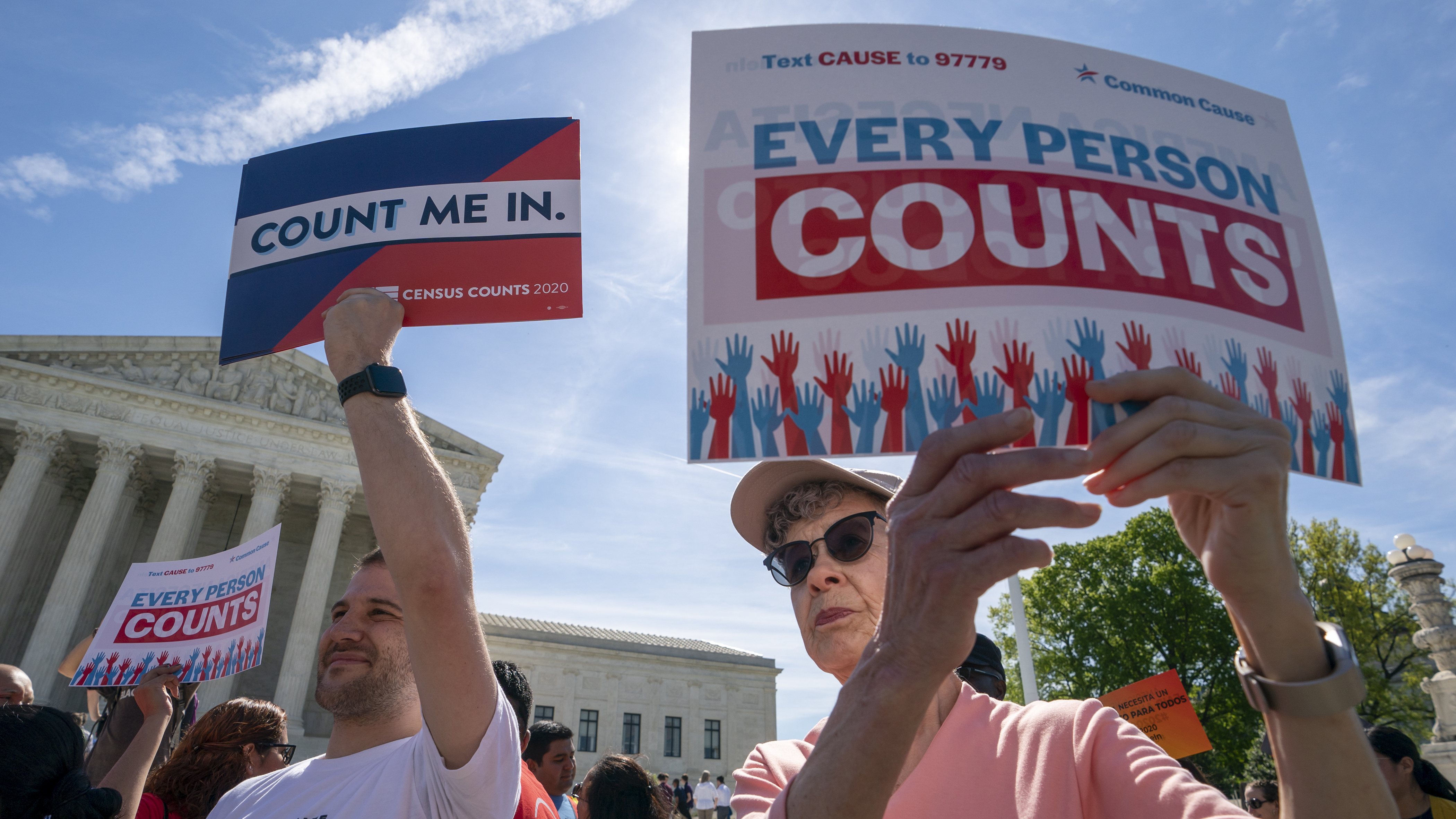 Demonstrators rally outside the Supreme Court in April as the justices hear arguments over the Trump administration's plan to add a citizenship question to 2020 census forms.
