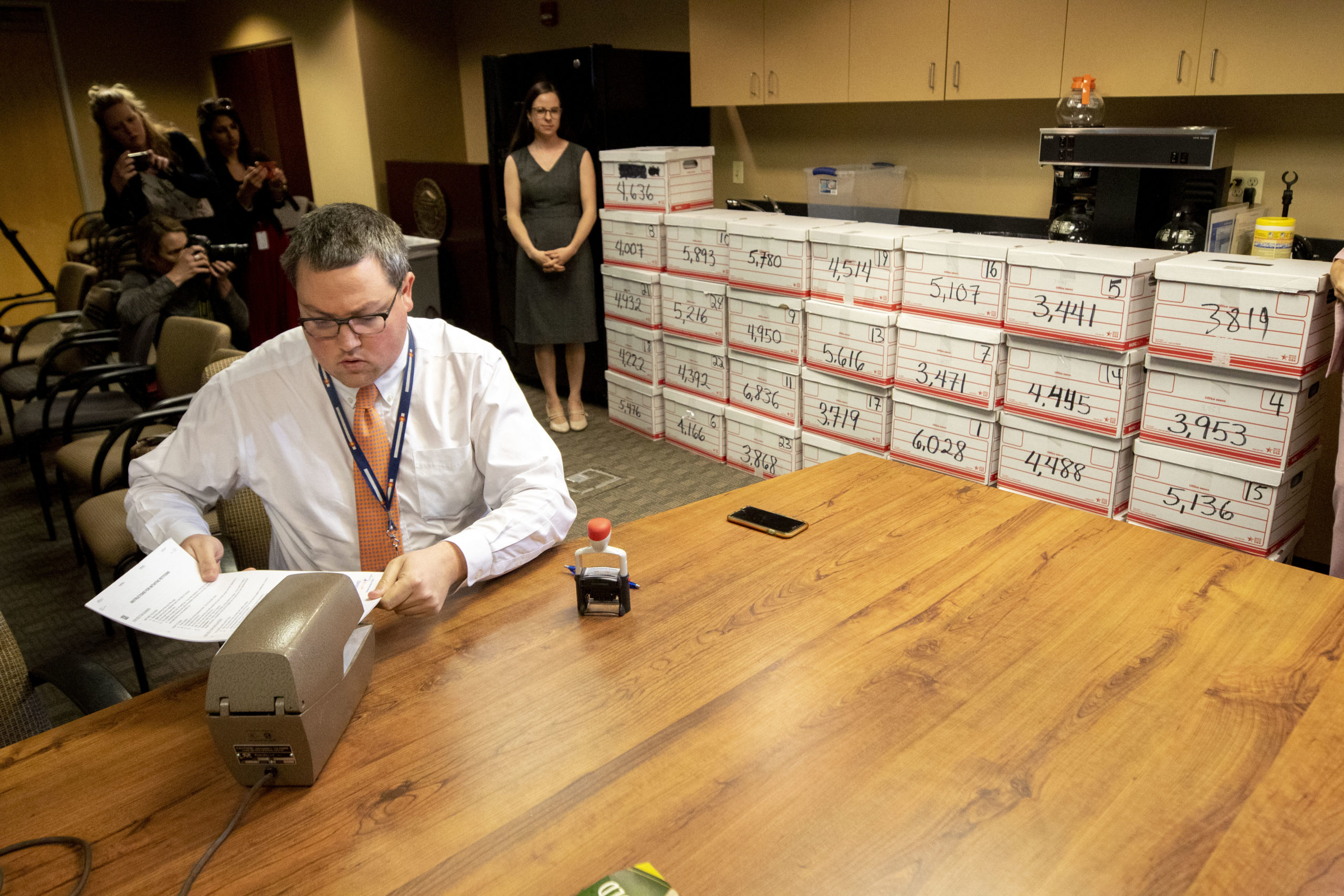 Jeff Mustin, petitions lead with the Colorado Secretary of State's office, timestamps a delivery of signatures for a 22-weeks abortion ban ballot measure. March 4, 2020.