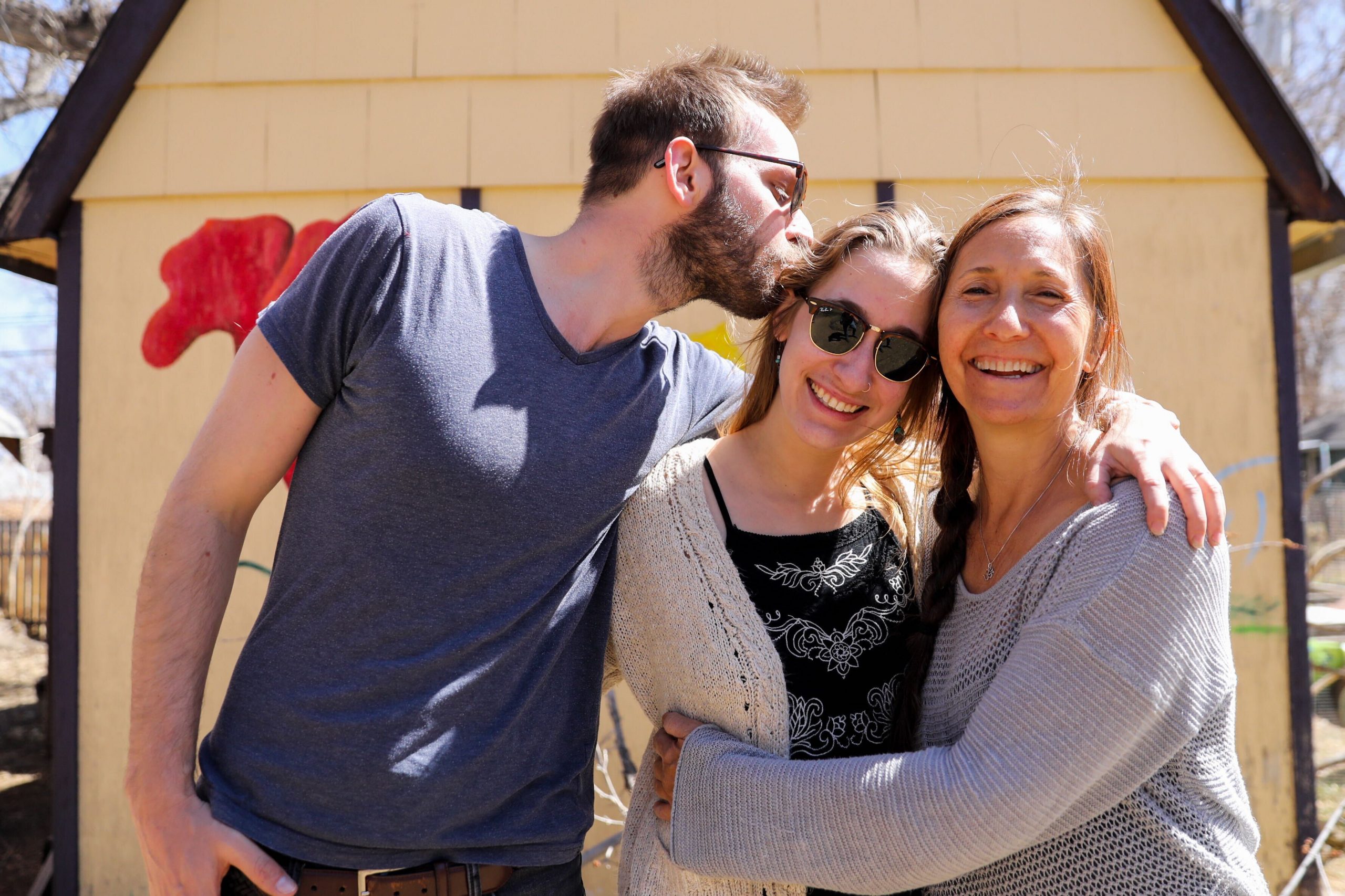 Hanna Bull (center) with her husband Raviv Bull and her mother Ramya Bruskin in the backyard of Ramya&#039;s home in Longmont on Monday, March 30, 2021.