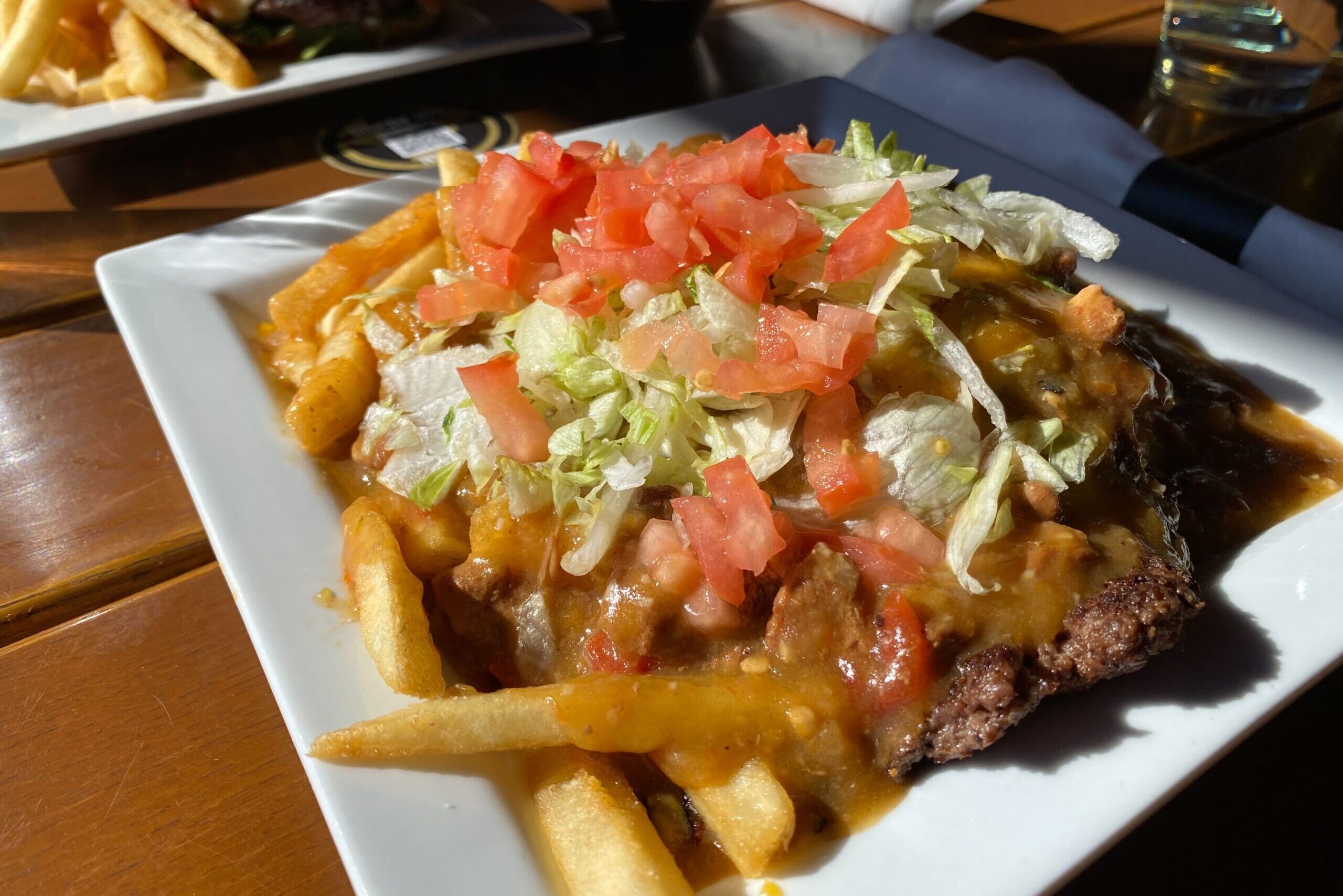 The Slopper, seen here from Brues Alehouse in downtown Pueblo, is a hamburger patty smothered in green chile. It also often features cheese, onions and French fries and is sometimes served open face.