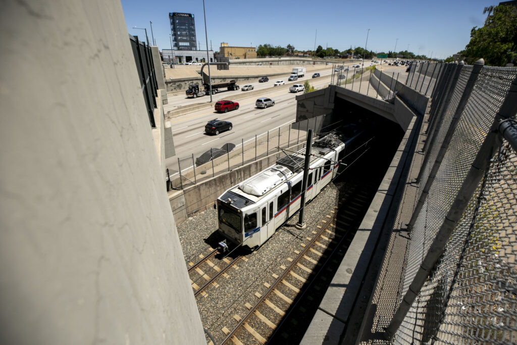 An RTD train passes under Evans Avenue in Denver. June 6, 2024.