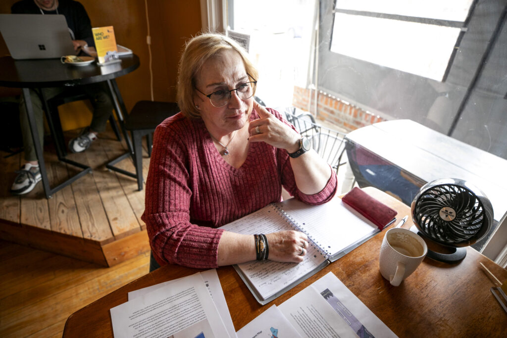 Carol Smith sits in Denver's Quince Coffee House on March 27, 2025.