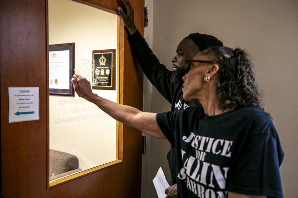 Veronica Seabron (right) and Martinez Anderson attempt to speak with anyone at the Douglas County Sheriff office