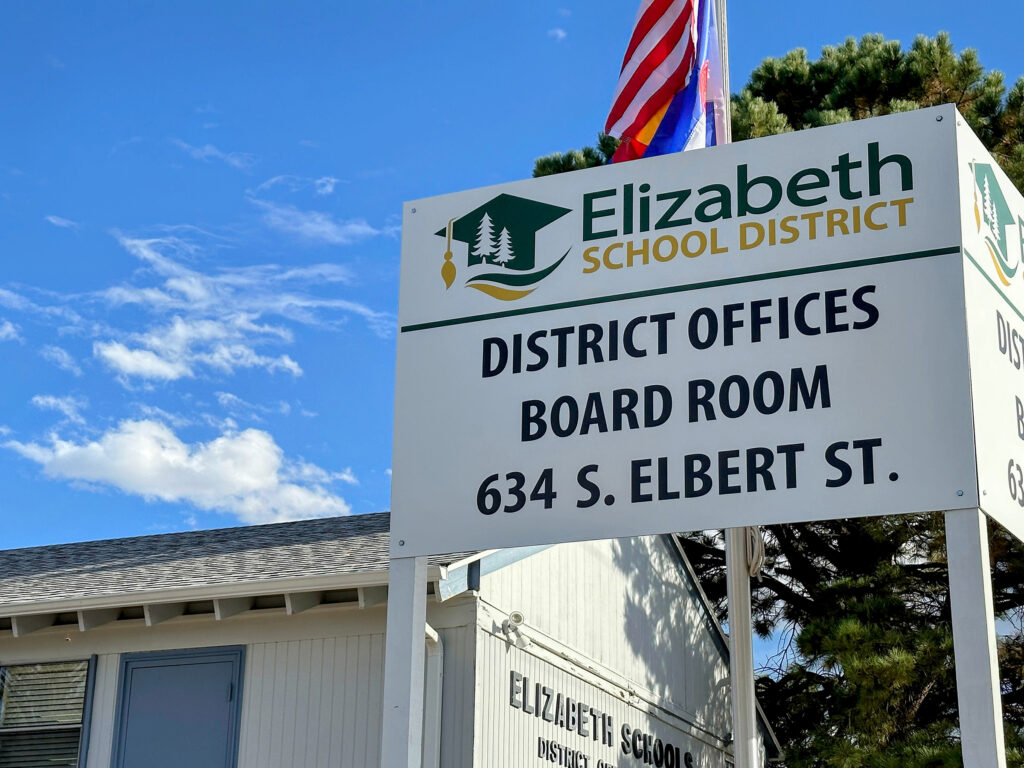 A sign about a school district.