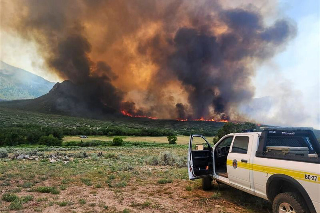 Smoke and flames pour from the Turner Gulch Fire