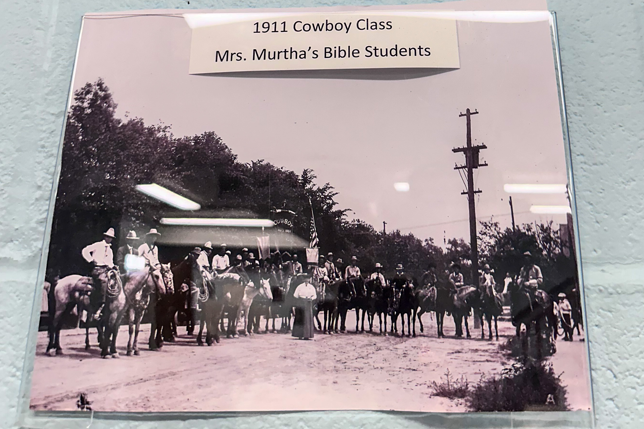 an old photo of people on horseback