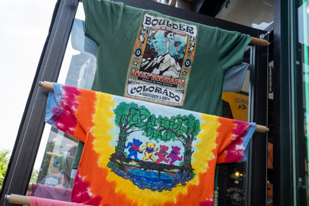 Grateful Dead-themed t-shirts adorn the door of a souvenir shop on Pearl Street in Boulder