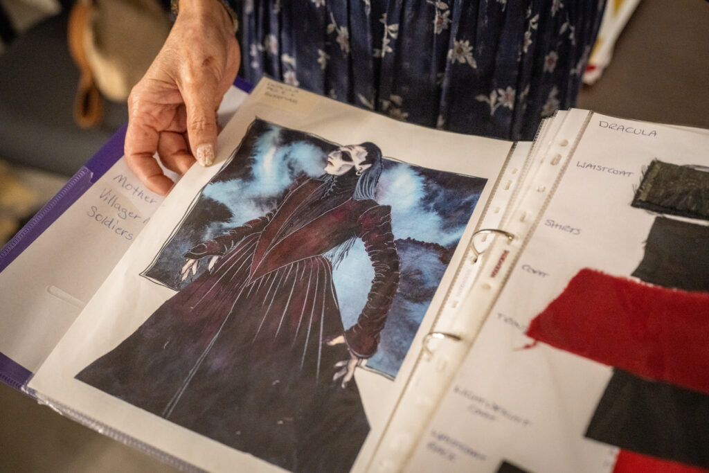 A book with drawings and suggested fabrics to use for Dracula costumes