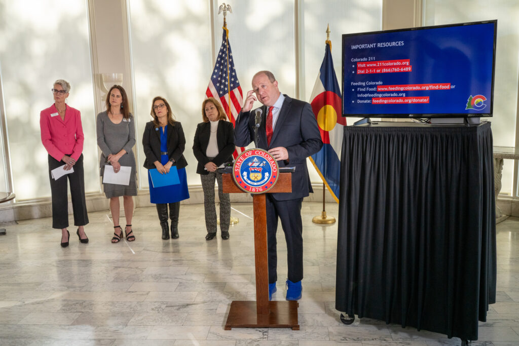 Food Bank of the Rockies President Erin Pulling speaks at a press conference