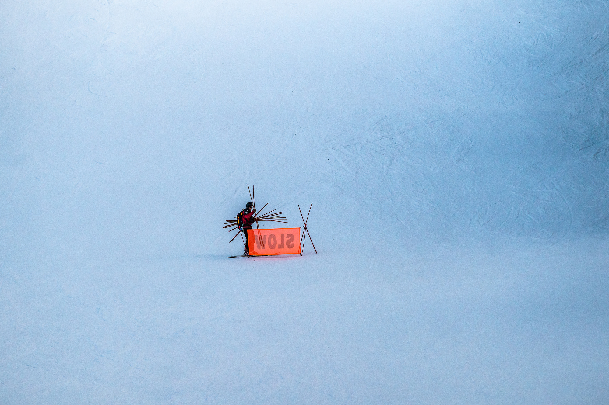 Ski patrol at Arapahoe Basin picking up signs at the end of the day