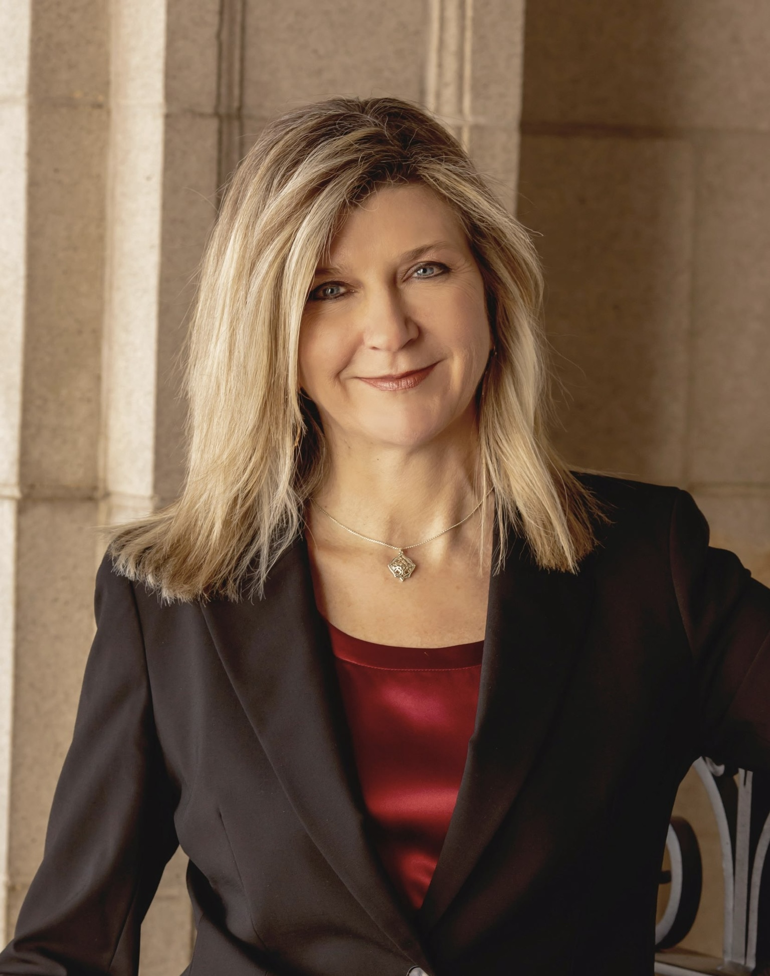 A woman poses for a photograph