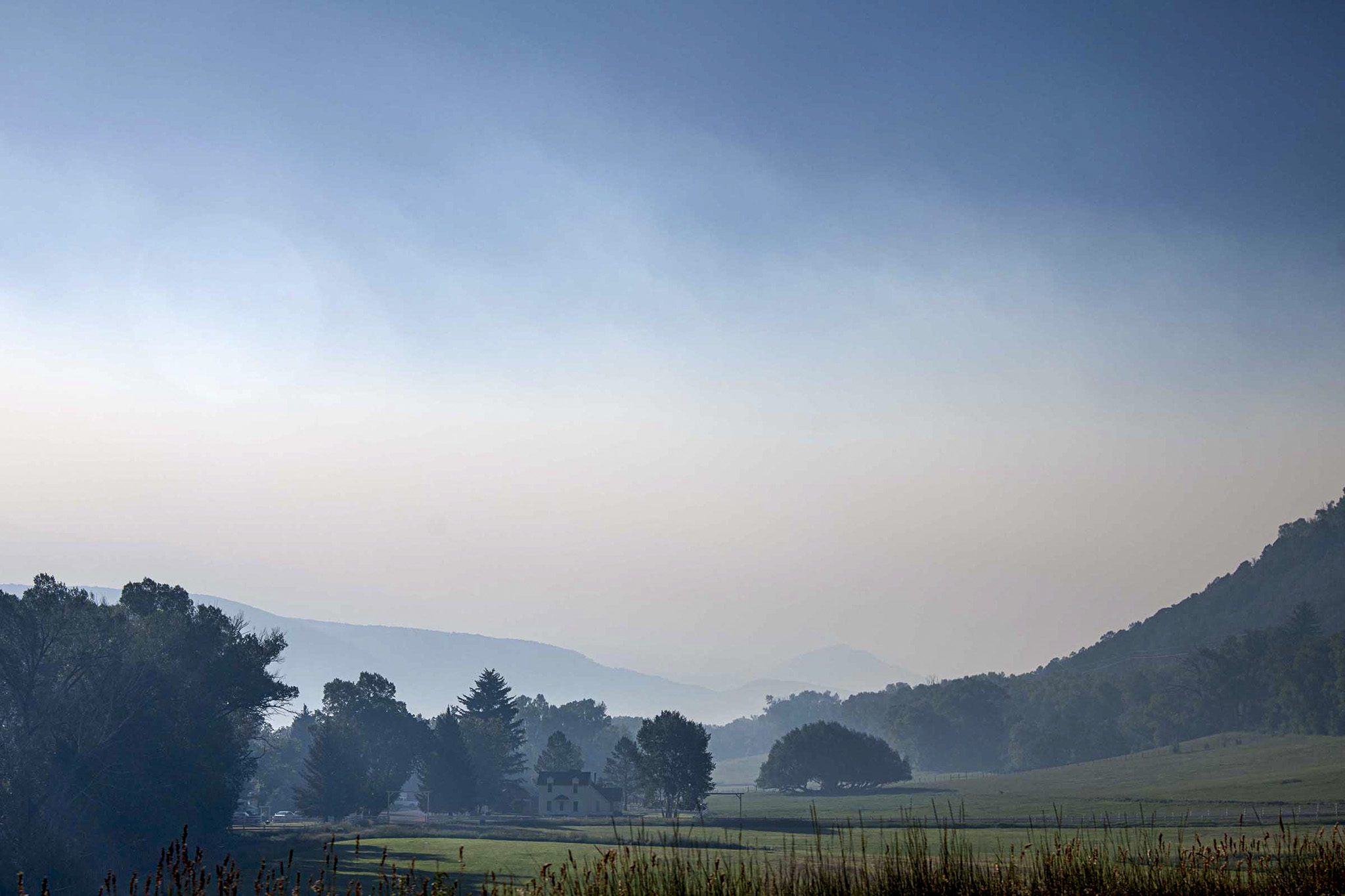 Hazy skies and wildfire smoke blanket Colorado